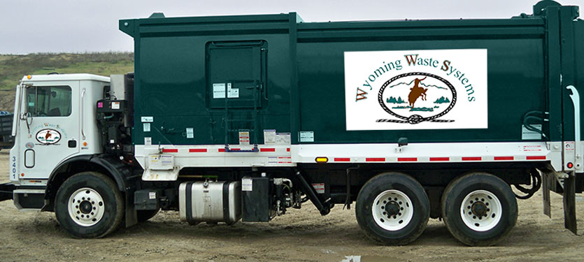 Wyoming Waste Systems rear load garbage truck.
